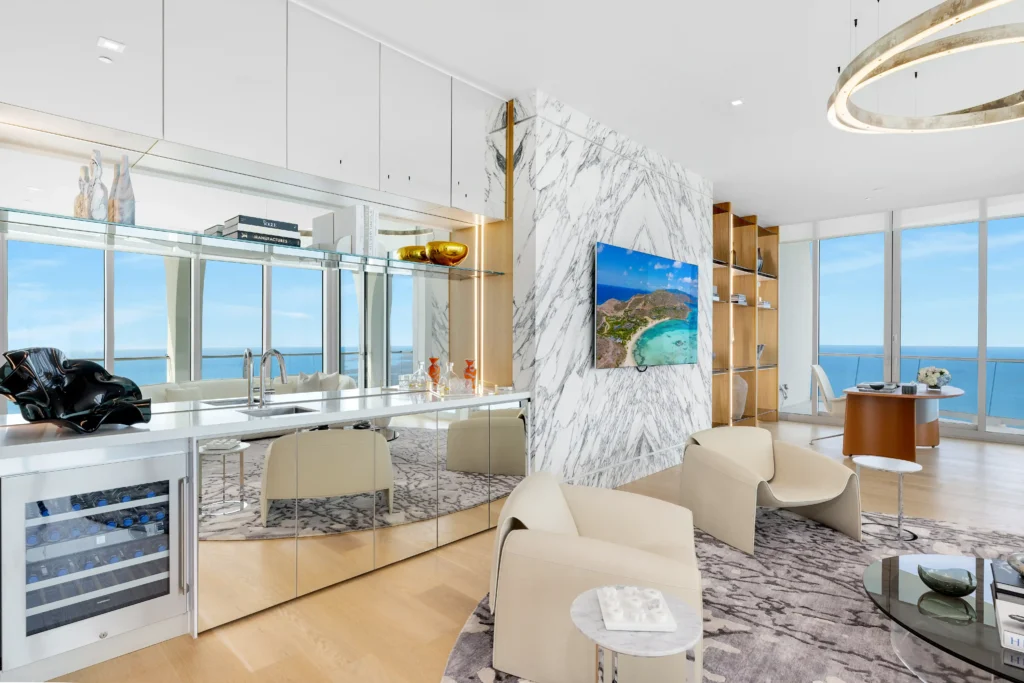 Billionaire Adam Weitsman sells his \$28.6m Miami penthouse featuring 12,000 sq ft of luxury living, a private spa, pools, sauna, and sweeping ocean and skyline views.