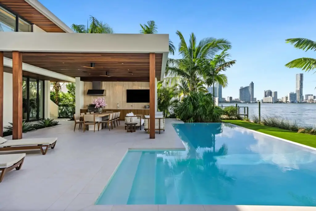 F1 star Eddie Irvine lists his £27.6m Miami waterfront mansion with 6 bedrooms, rooftop terrace, theatre, pool and 360° views of Biscayne Bay and the city skyline.