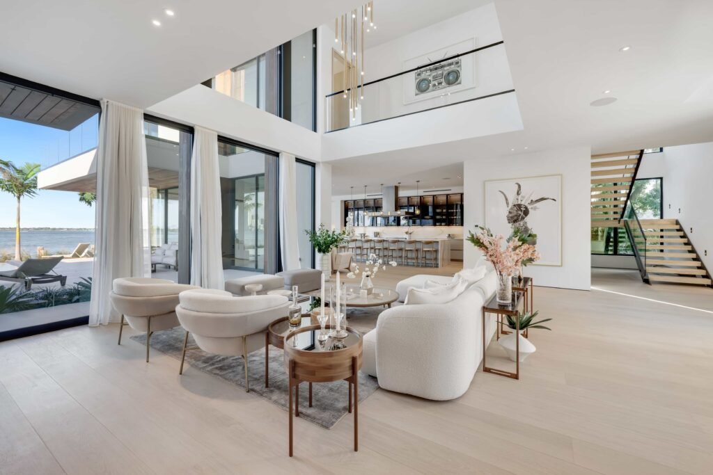 F1 star Eddie Irvine lists his £27.6m Miami waterfront mansion with 6 bedrooms, rooftop terrace, theatre, pool and 360° views of Biscayne Bay and the city skyline.