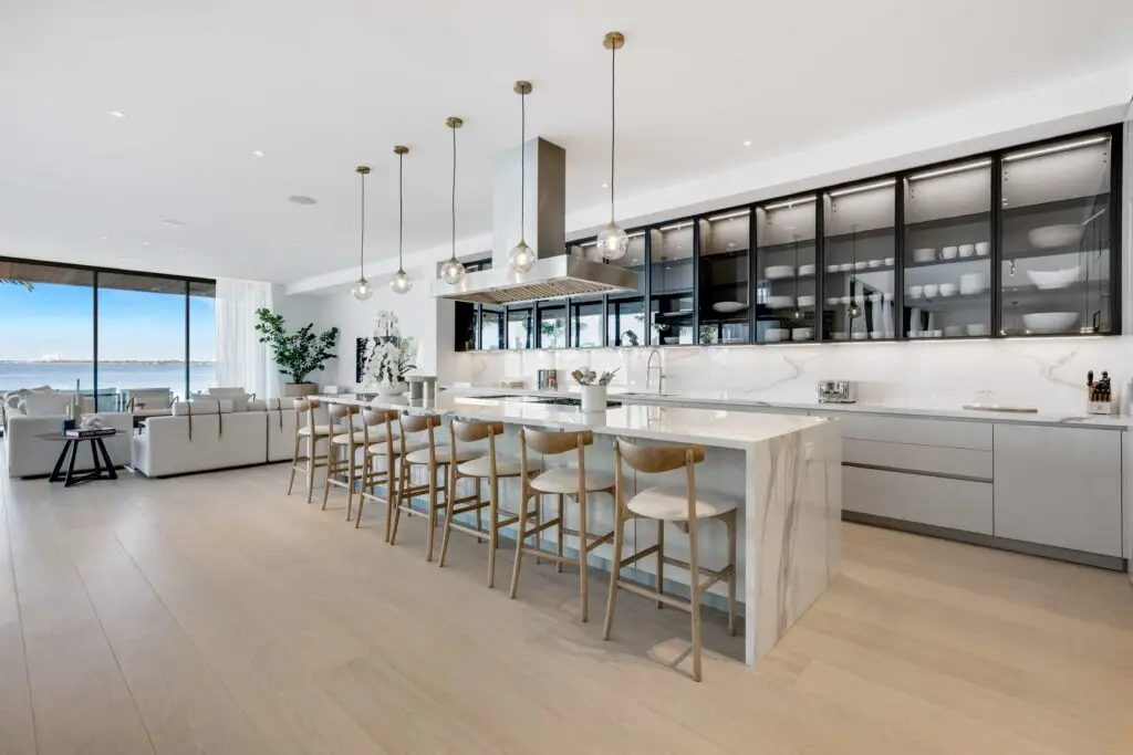 F1 star Eddie Irvine lists his £27.6m Miami waterfront mansion with 6 bedrooms, rooftop terrace, theatre, pool and 360° views of Biscayne Bay and the city skyline.