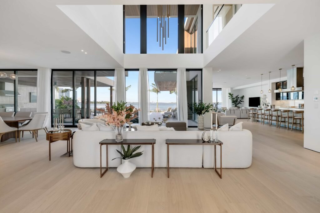 F1 star Eddie Irvine lists his £27.6m Miami waterfront mansion with 6 bedrooms, rooftop terrace, theatre, pool and 360° views of Biscayne Bay and the city skyline.