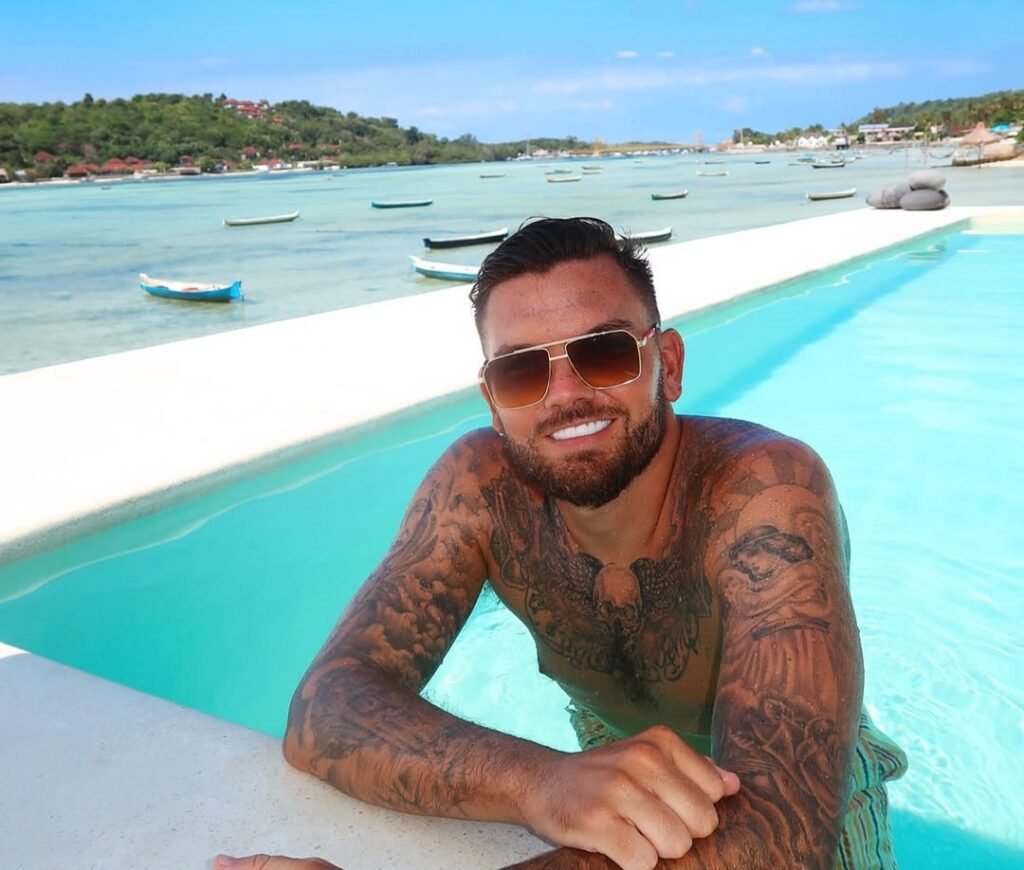 Love Island star Sam Gowland sparks backlash after telling fans to spend £20k on a mentor instead of buying a house, with critics calling his advice out of touch.