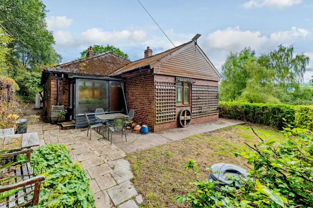 A £520k hidden woodland home in Shropshire offers total privacy, rare plants, historic mine features and nearly an acre of gardens with stunning countryside views.