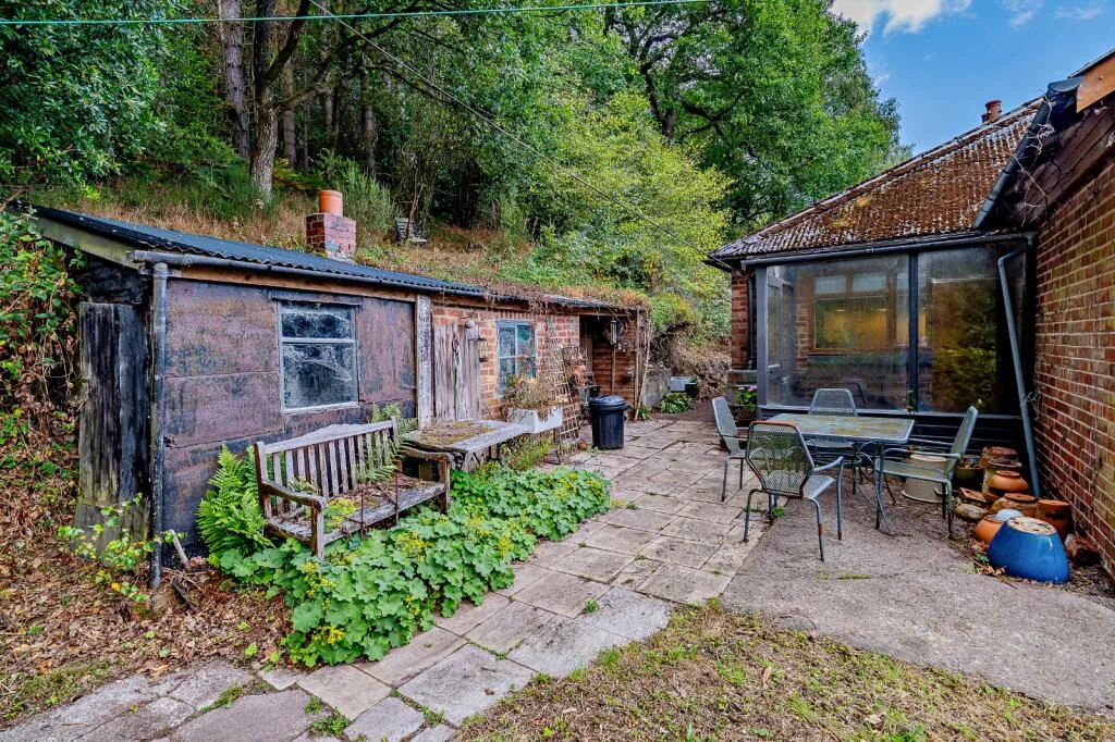 A £520k hidden woodland home in Shropshire offers total privacy, rare plants, historic mine features and nearly an acre of gardens with stunning countryside views.