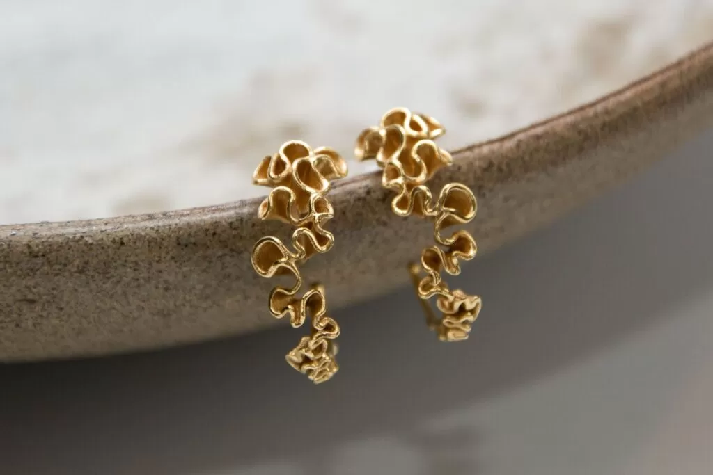 Sisters Karen and Alice Chave turn old iPhones into ethical gold jewellery with their brand Incador, making £25k by transforming e-waste into luxury sustainable pieces.