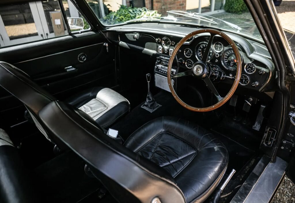 A rare 1966 Aston Martin DB6 Mk1 Vantage with a prized manual gearbox and fewer than 5,000 miles since 1991 has sold at Silverstone auction for £216,000.