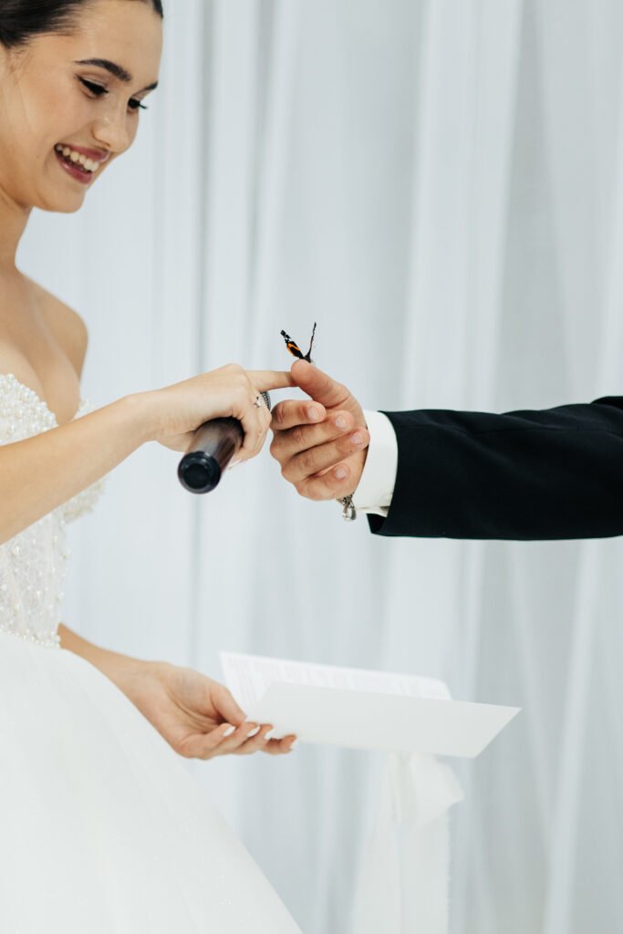 A butterfly stole the show at a Ukrainian wedding, landing on the bride and groom mid vows in a magical moment that went viral with 12 million Instagram views.