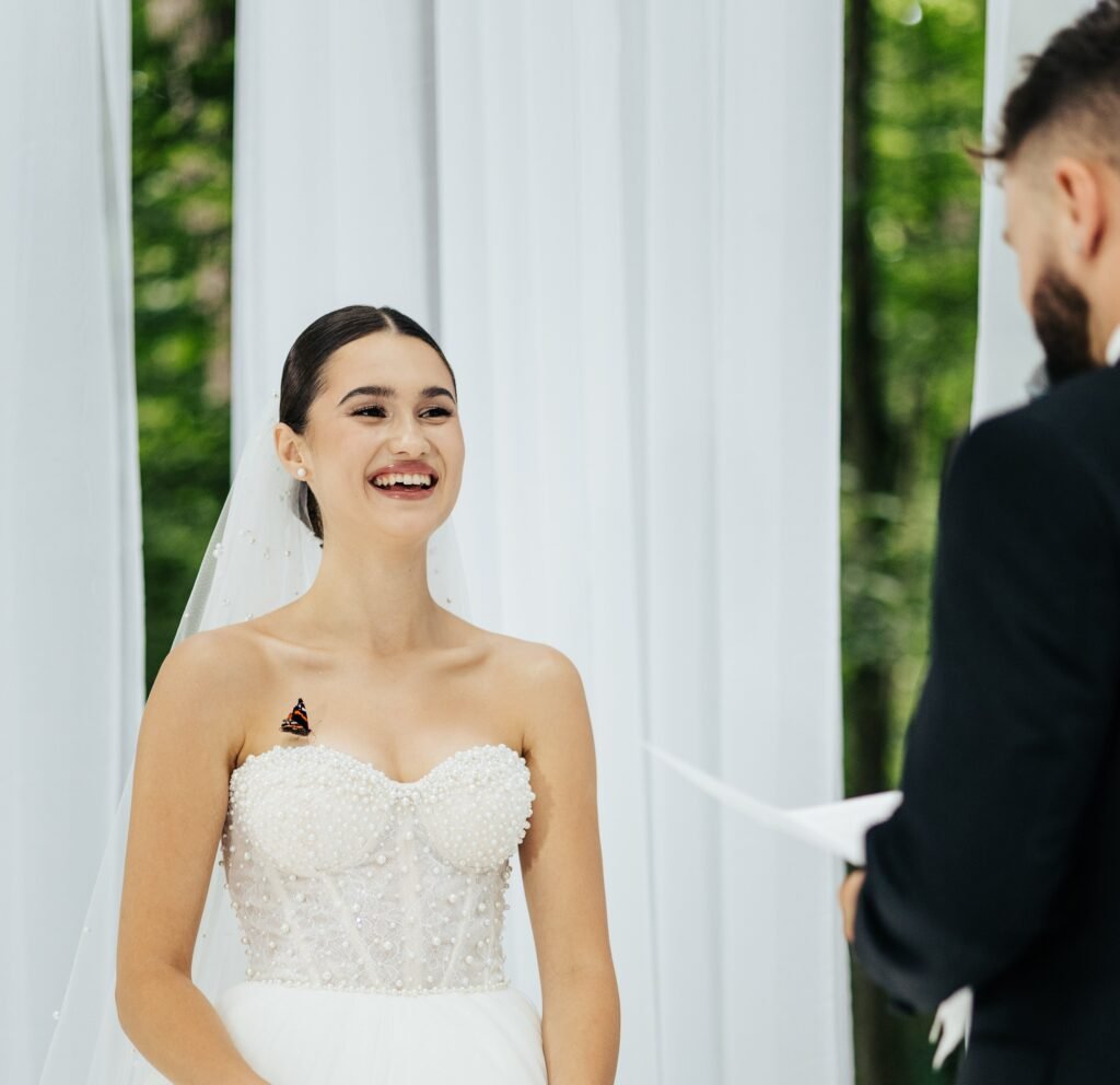 A butterfly stole the show at a Ukrainian wedding, landing on the bride and groom mid vows in a magical moment that went viral with 12 million Instagram views.