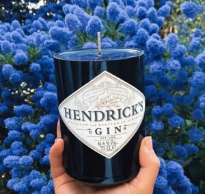 Woman turns leftover bottles into luxury candles building a kitchen table side hustle that grows to £5,000 a month and £8,000 at Christmas transforming her life and career.
